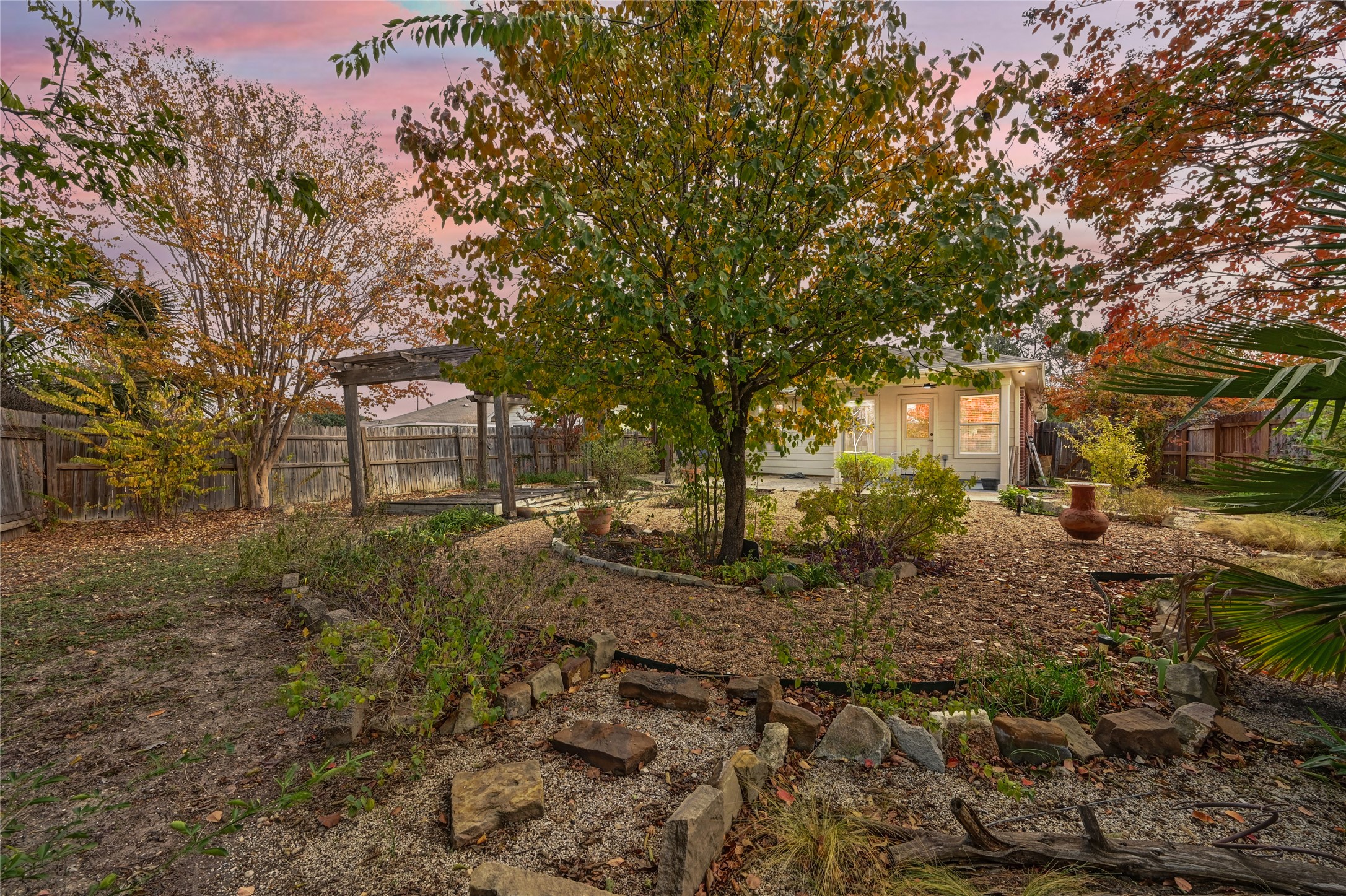 7620 Cayenne Lane Austin, TX 78741 - Photo 26 of 27 a view of a yard with plants and trees