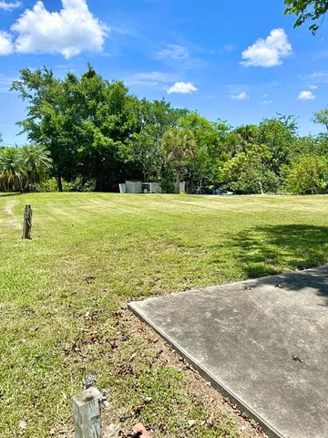 a view of a golf course with a trees