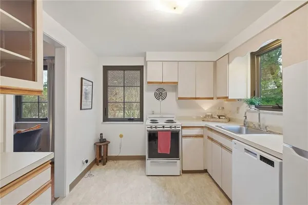 a kitchen with stainless steel appliances granite countertop a sink stove and granite counter tops