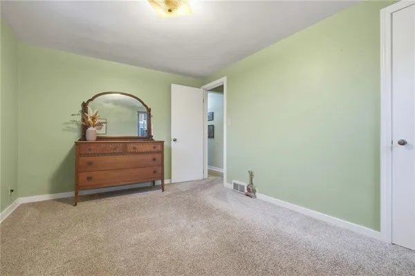 a room with a table and a mirror