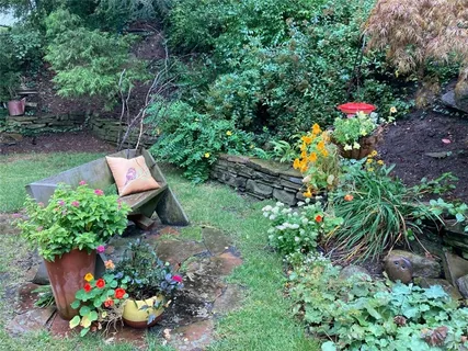 a aerial view of a house with a yard and garden