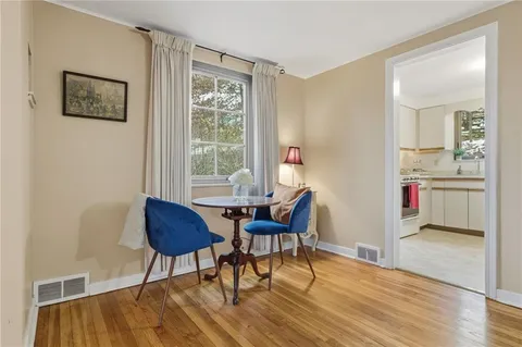 a workspace with furniture and wooden floor