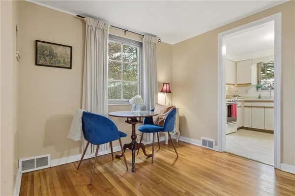 a workspace with furniture and wooden floor