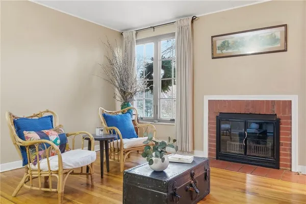 a view of a livingroom with furniture and a fireplace