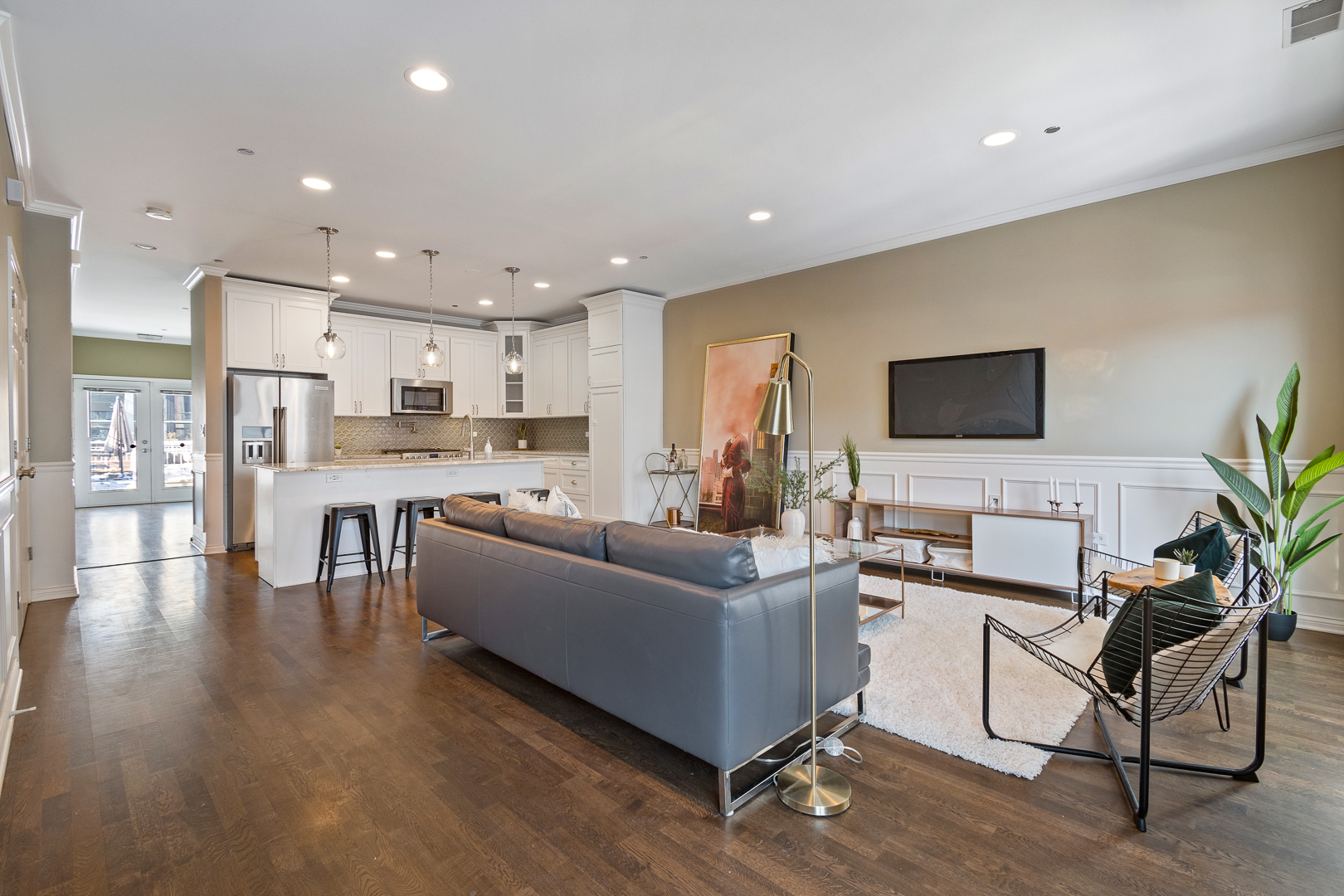 51 West 15th Street, Unit K2 Chicago, IL 60605 - Photo 5 of 28 a living room with stainless steel appliances kitchen island granite countertop a couch and a view living room with wooden floor