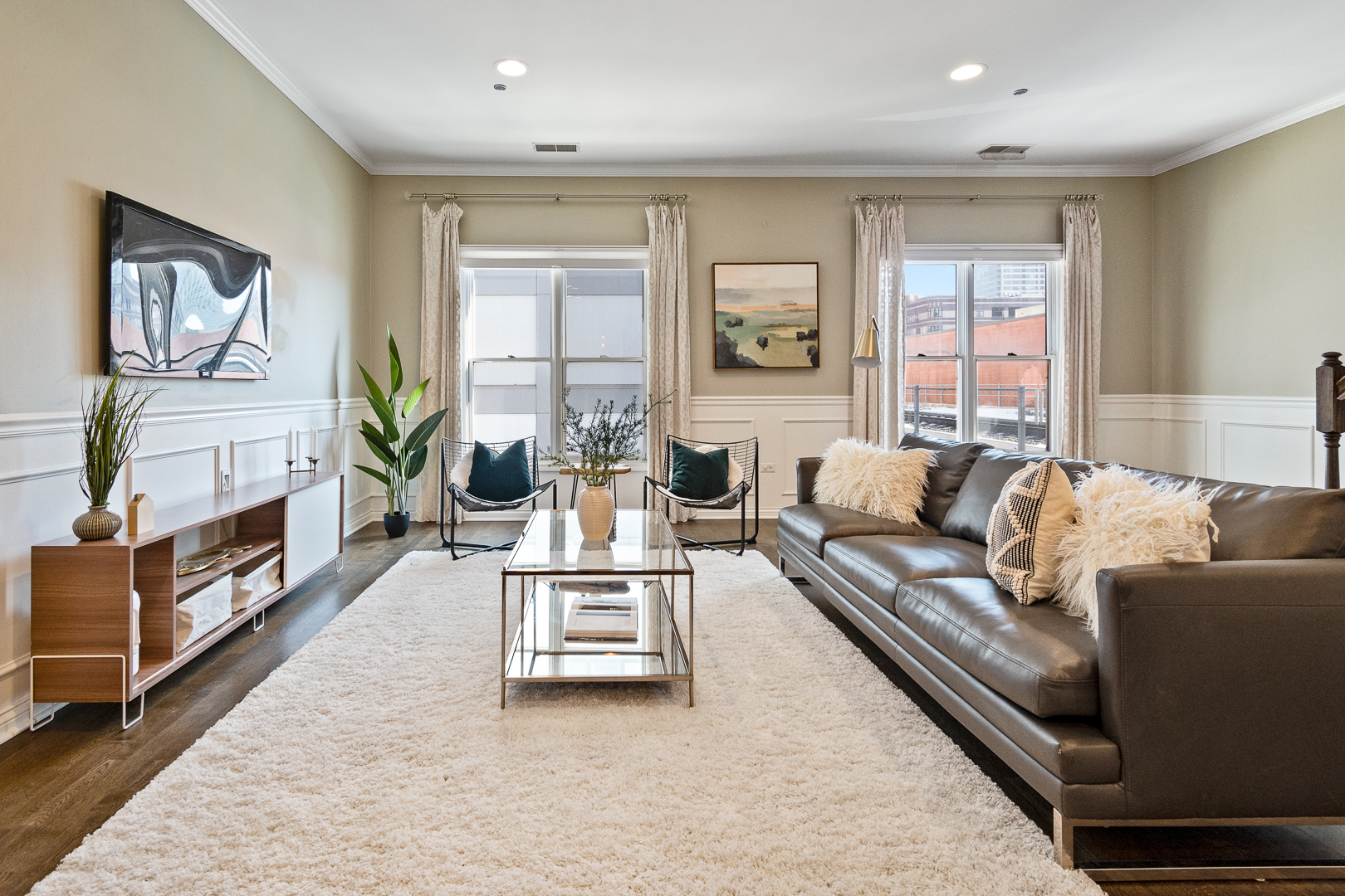 51 West 15th Street, Unit K2 Chicago, IL 60605 - Photo 6 of 28 a living room with furniture fireplace and flat screen tv