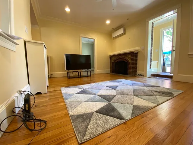 a view of a livingroom with furniture and a fireplace