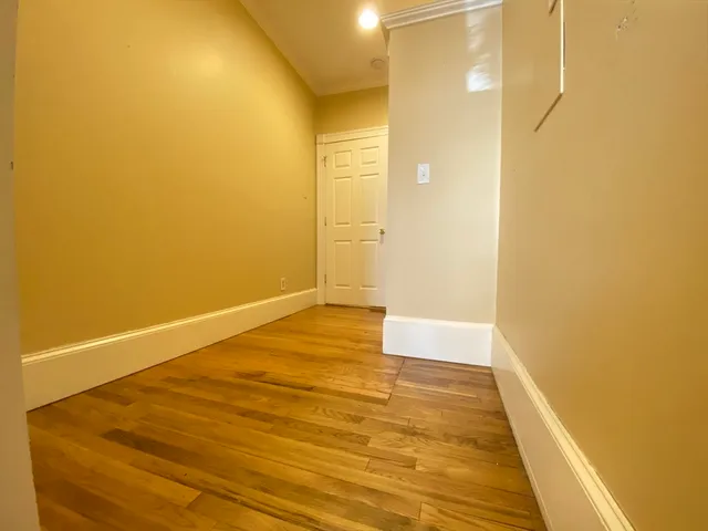 a bathroom with a wooden floor