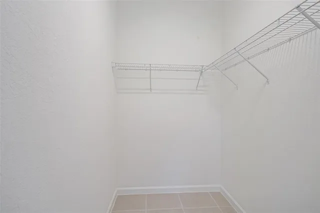 a bathroom with a granite countertop sink toilet a large mirror a bathtub and shower