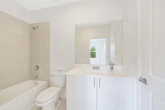 a bathroom with a toilet a sink and bathtub