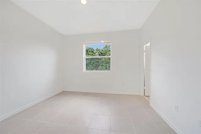 a view of bathroom with a sink toilet and mirror