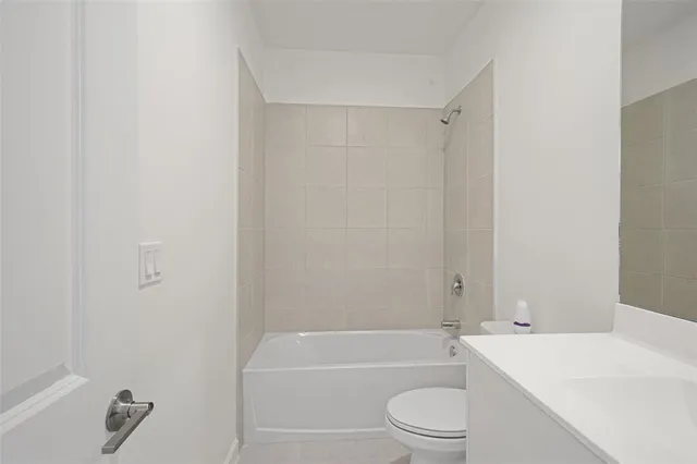 a bathroom with a shower and a toilet