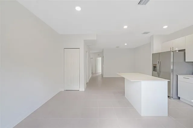 a view of a storage & utility room with a sink