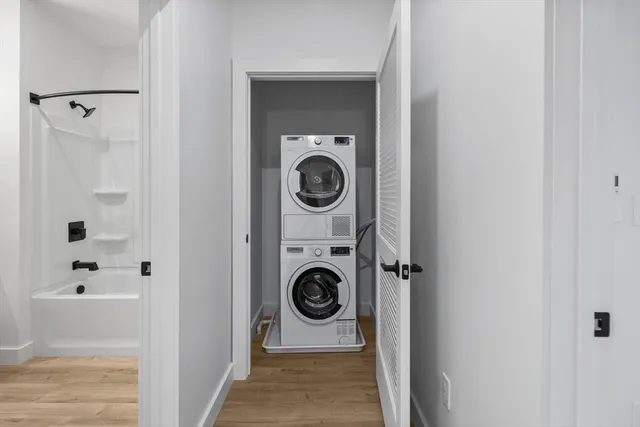 a utility room with sink dryer and washer