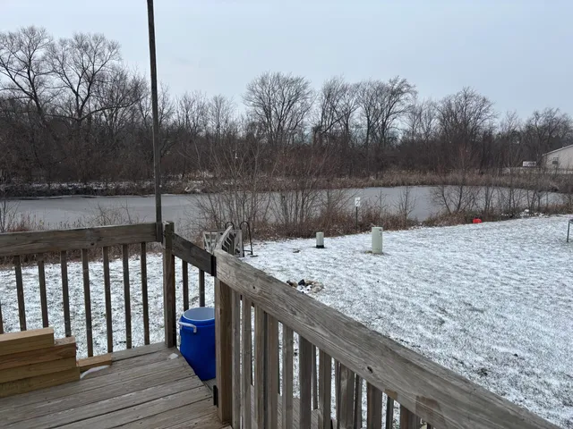 a view of a chairs and table in the balcony