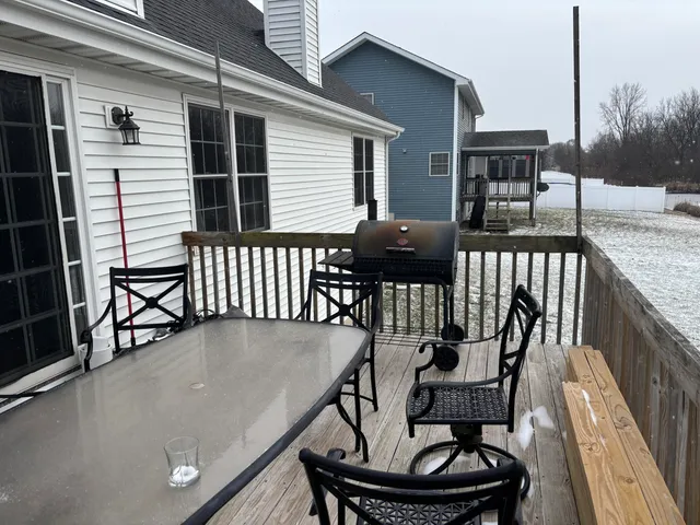 a view of balcony with furniture