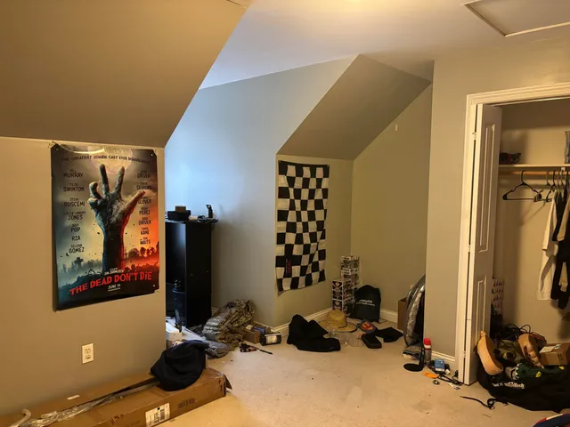 a room with gym equipment and a mirror