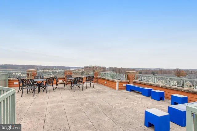 a balcony with furniture and city view
