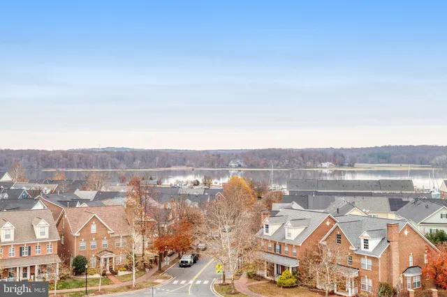 an aerial view of residential houses with city view