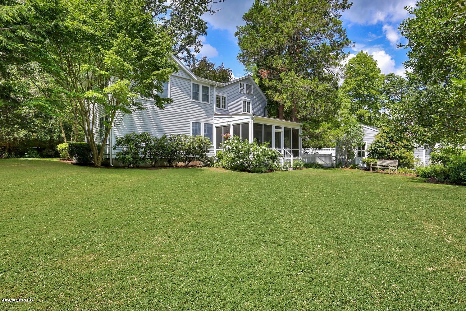 11 Indian Head Road Riverside, CT 06878 - Photo 1 of 30 a front view of house with yard and green space
