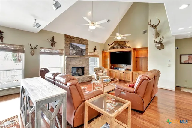 a living room with fireplace furniture and a flat screen tv