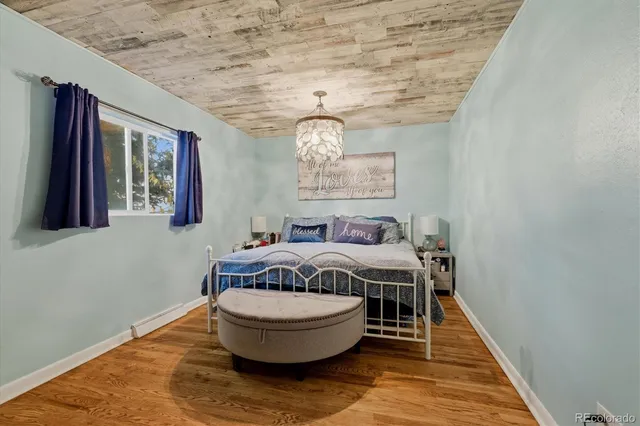 a spacious bedroom with a bed and window