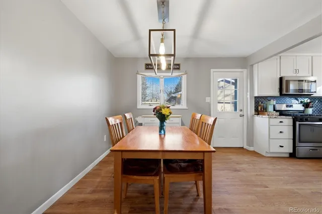 a dining room with furniture and window