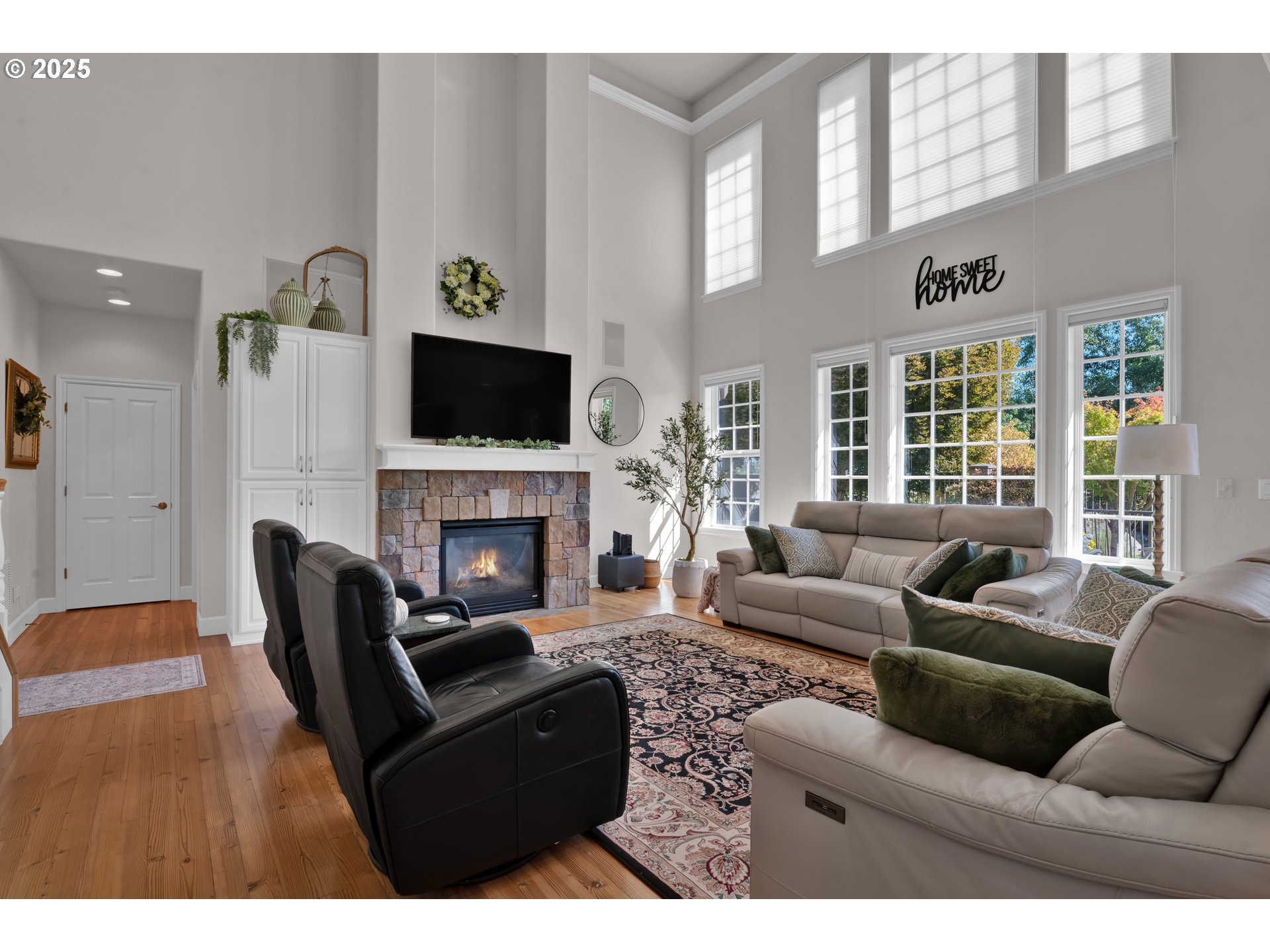 685 St Andrews Loop Creswell, OR 97426 - Photo 11 of 47 a living room with furniture a fireplace and a flat screen tv