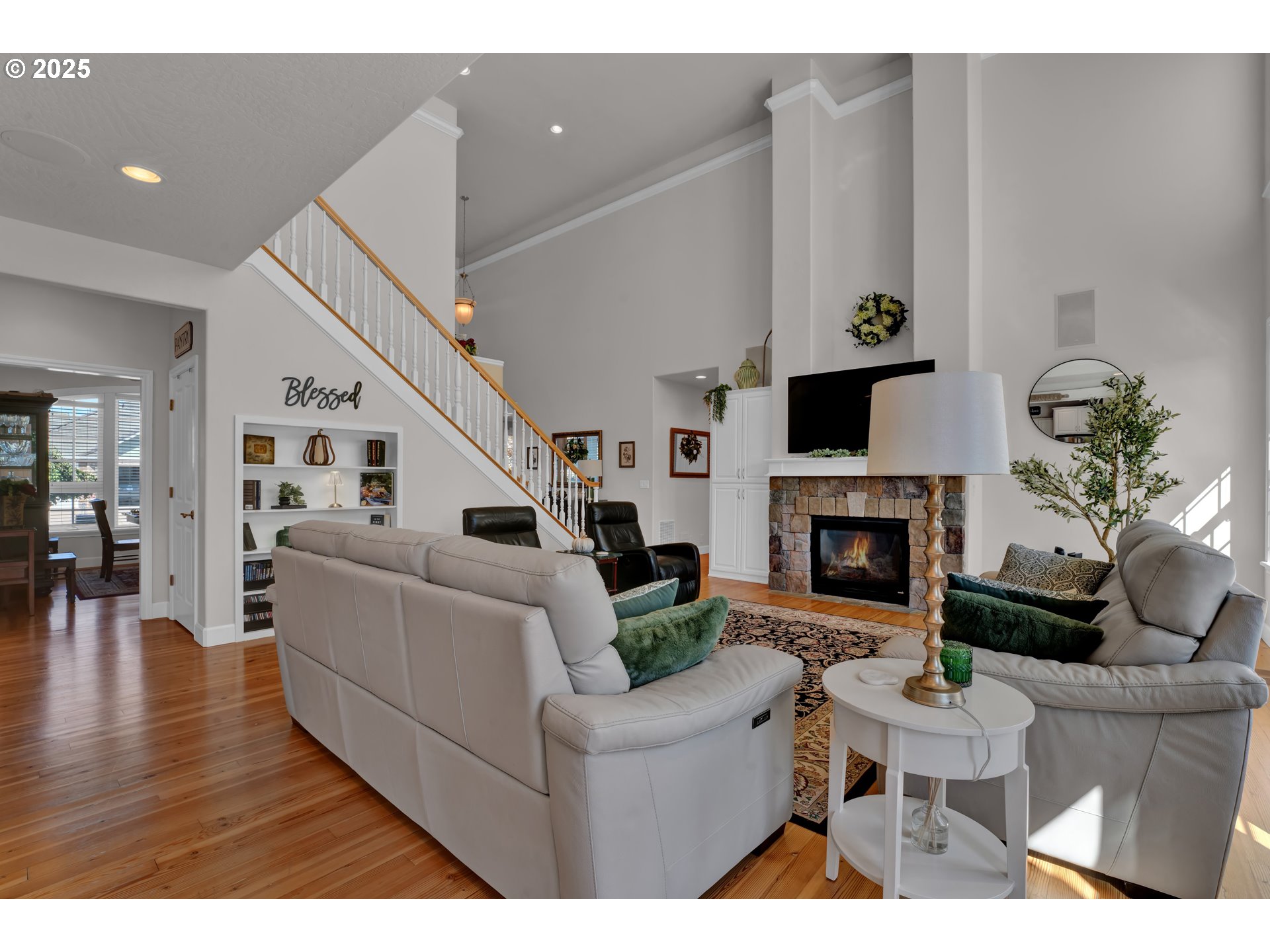 685 St Andrews Loop Creswell, OR 97426 - Photo 13 of 47 a living room with furniture a fireplace and a potted plant