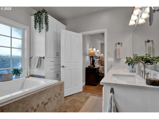 a living room with furniture potted plant and a chandelier