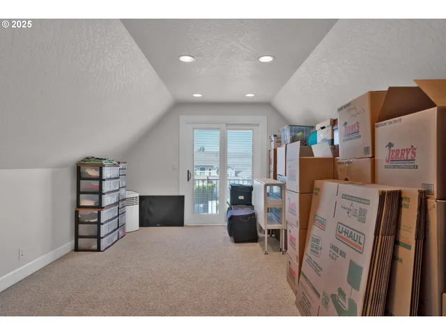 a view of livingroom with furniture and workspace
