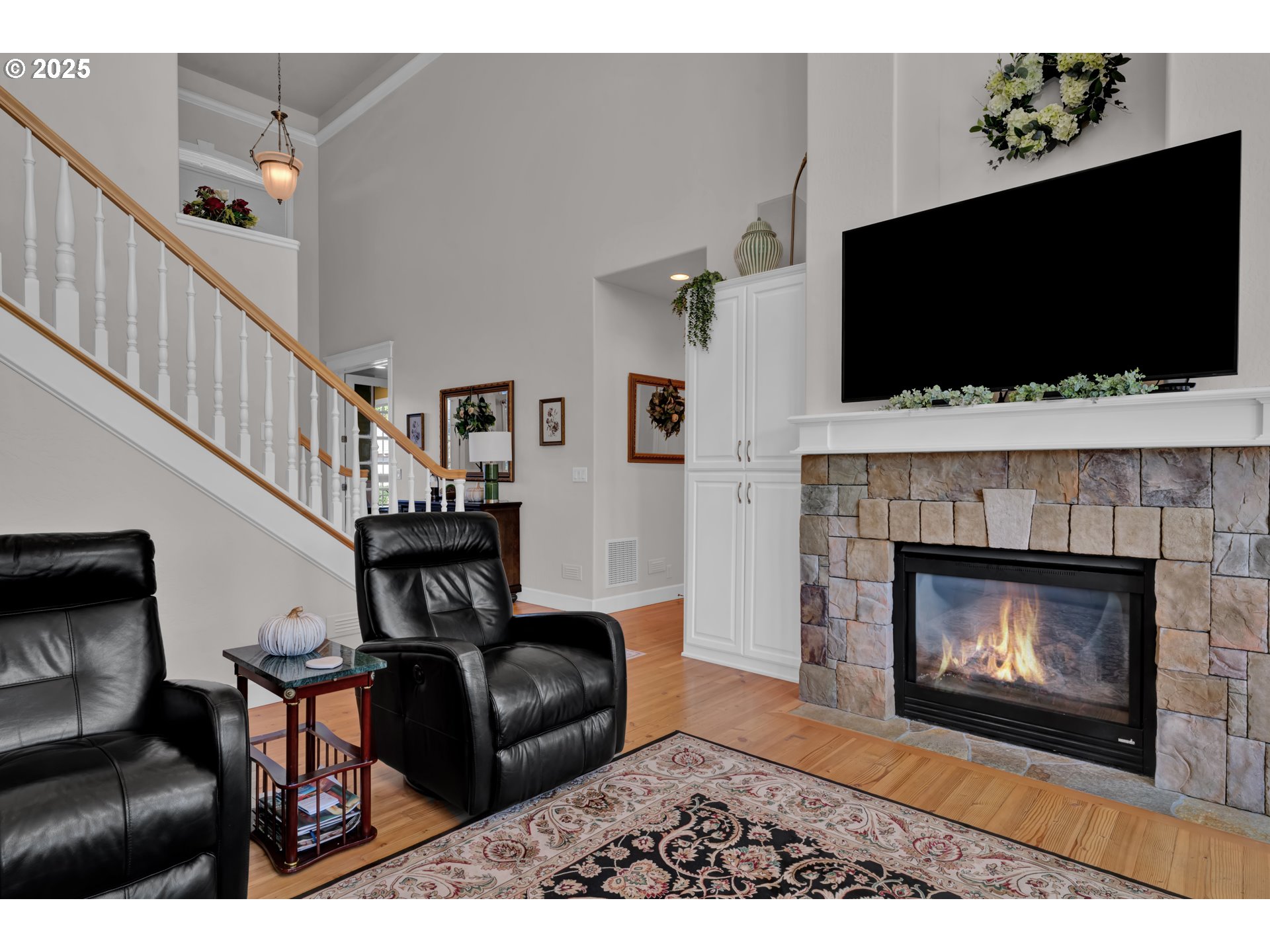 685 St Andrews Loop Creswell, OR 97426 - Photo 9 of 47 a living room with furniture a flat screen tv and a fireplace