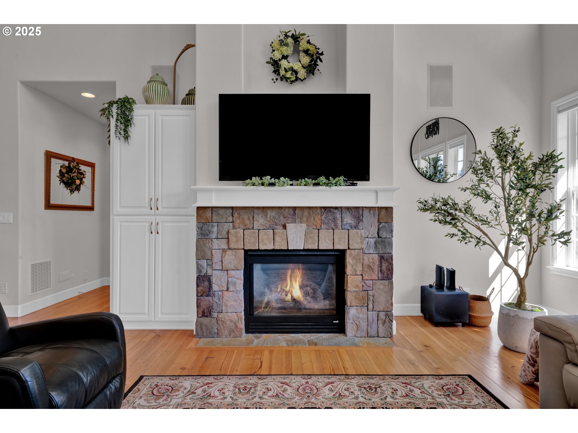 685 St Andrews Loop Creswell, OR 97426 - Photo 10 of 47 a living room with furniture a flat screen tv and a fireplace
