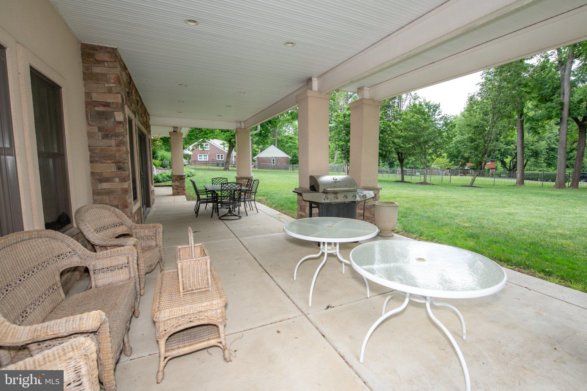 711 Moredon Road Jenkintown, PA 19046 - Photo 22 of 140 Spacious patio with lush greenery.