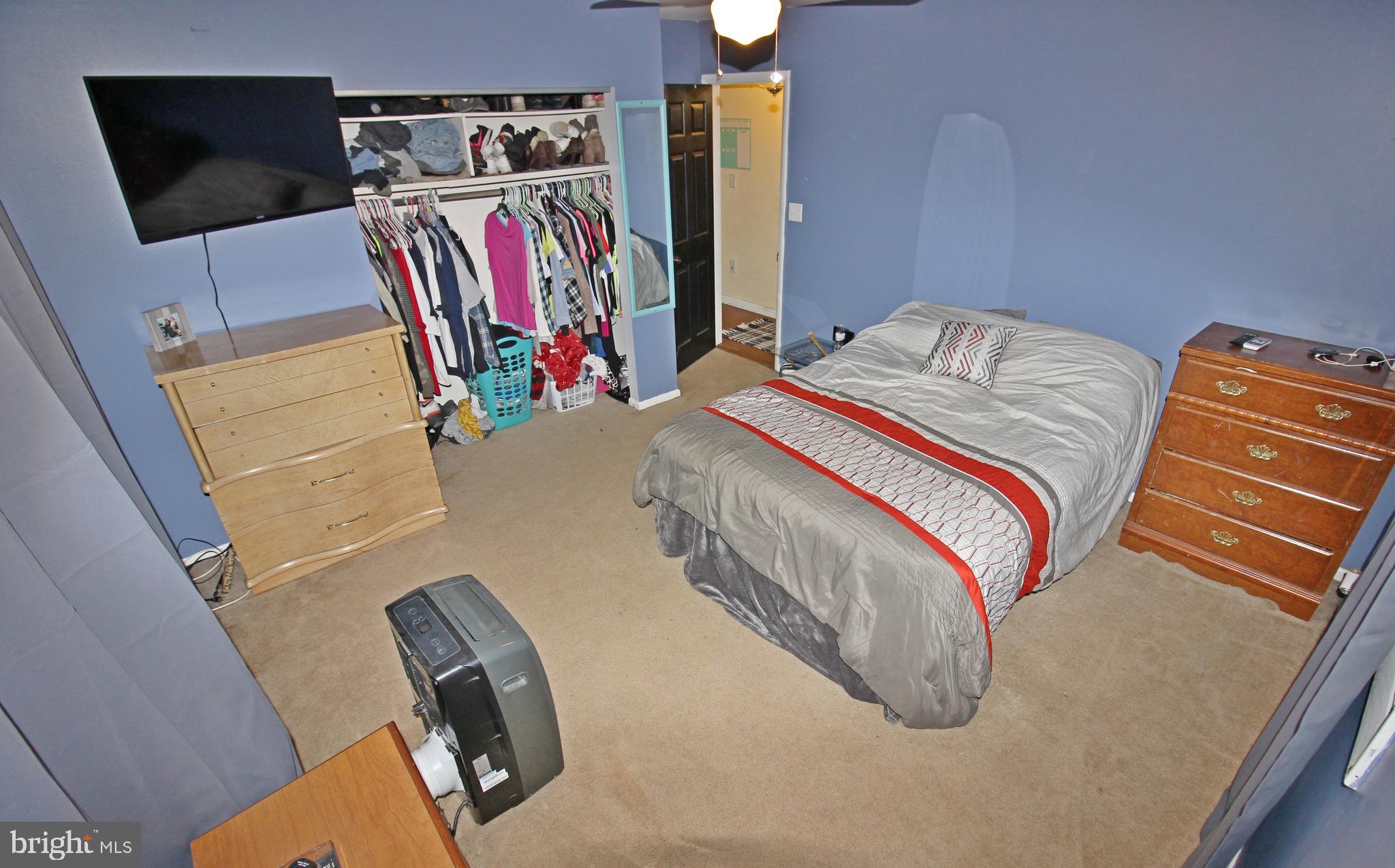 208 Cardinal Road Lititz, PA 17543 - Photo 22 of 40 a bedroom with a bed and a flat screen tv