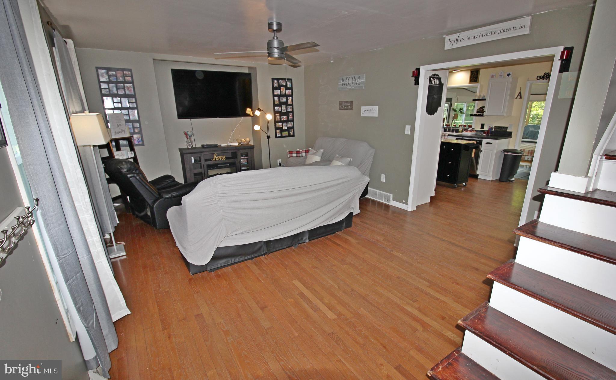 208 Cardinal Road Lititz, PA 17543 - Photo 6 of 40 a living room with furniture and a flat screen tv