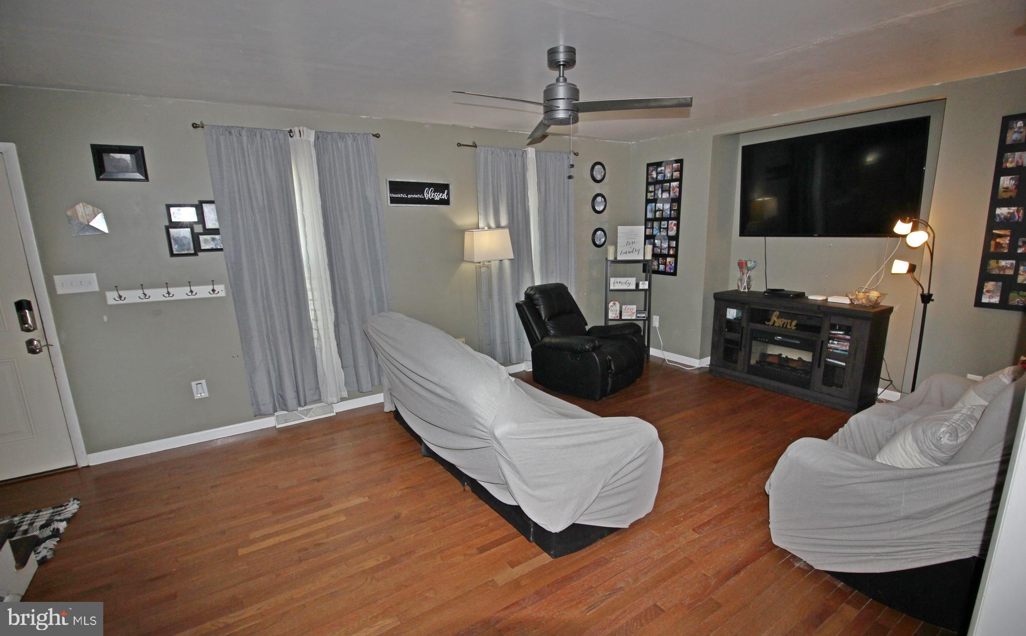 208 Cardinal Road Lititz, PA 17543 - Photo 8 of 40 a living room with furniture and a flat screen tv