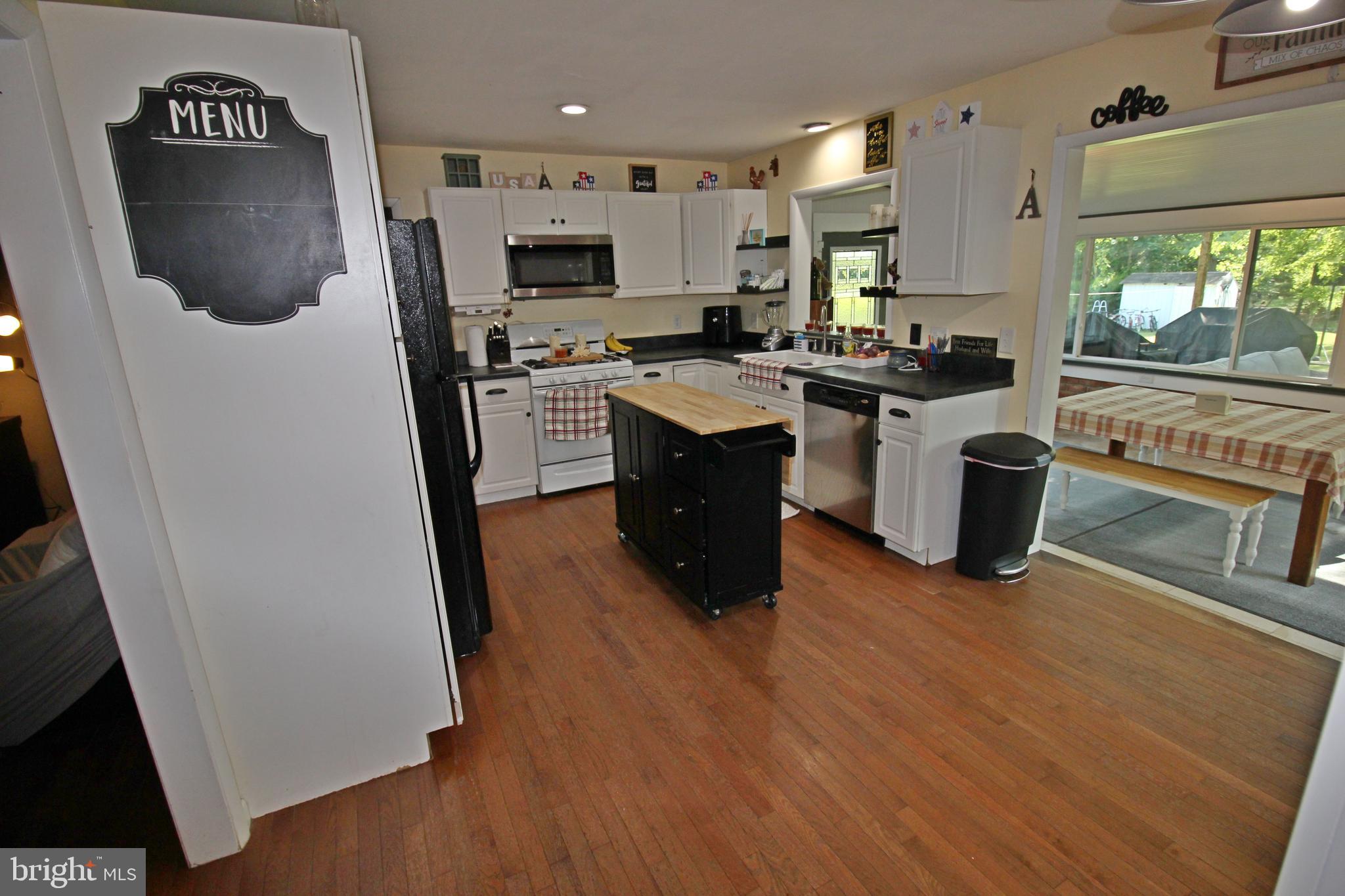 208 Cardinal Road Lititz, PA 17543 - Photo 9 of 40 a kitchen with stainless steel appliances a refrigerator a stove a sink a microwave a counter top space and cabinets
