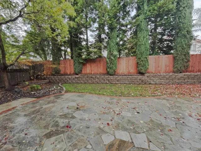 a wooden bench with view of trees