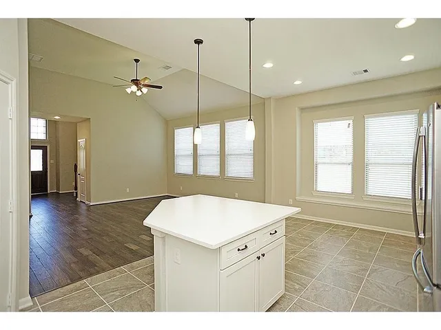 a kitchen with a sink and a large window