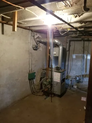 a room with a fireplace and a table