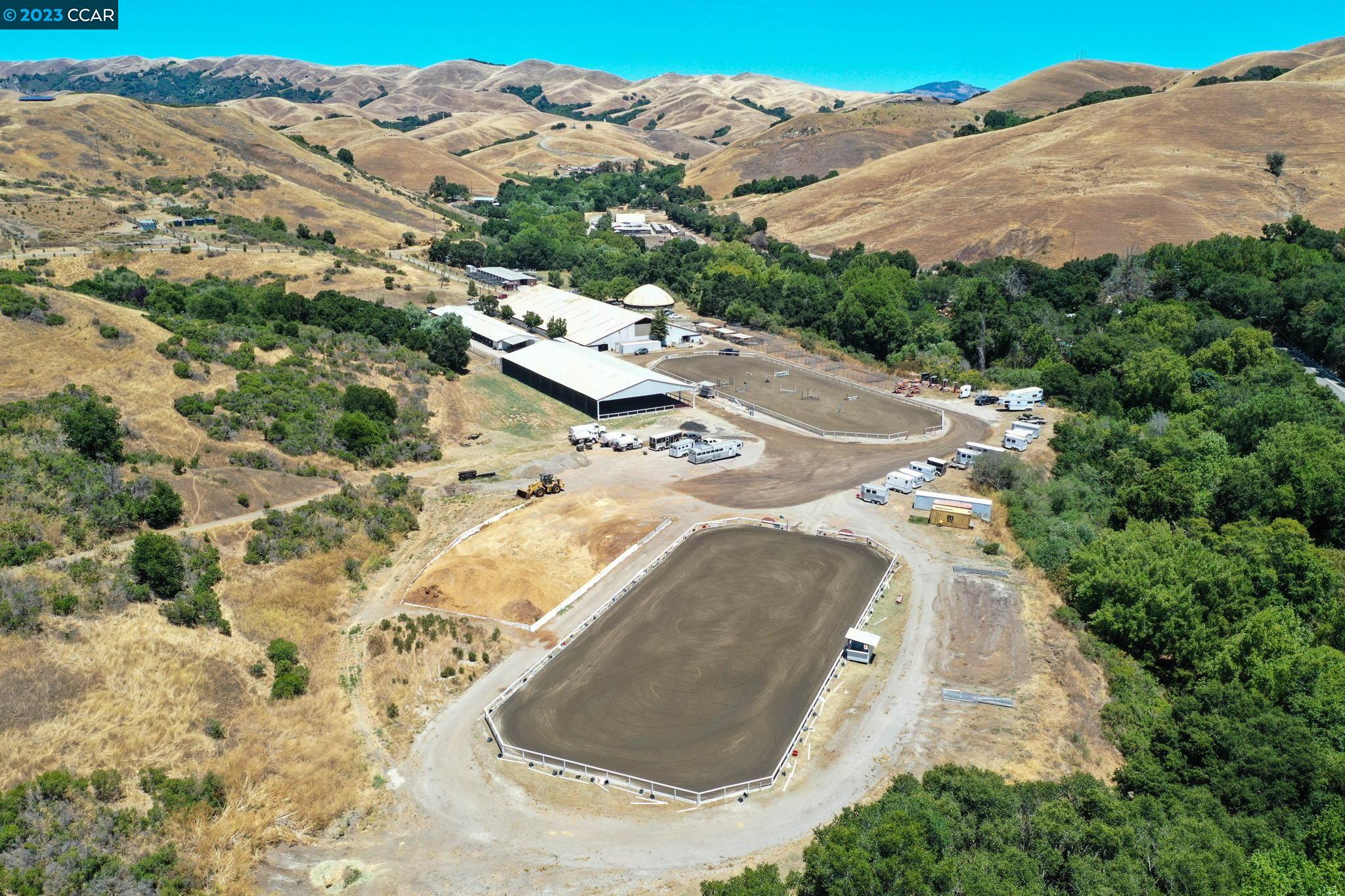 10250 Crow Canyon Road Castro Valley, CA 94552 - Photo 1 of 60 an aerial view of a house with a mountain