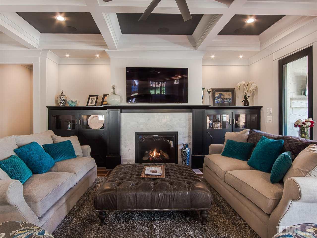 3210 Cobblestone Court Raleigh, NC 27607 - Photo 11 of 23 Has all the great makings of a Relaxing time at Home.Gorgeous Gas Fireplace w Marble surround, Coffered Ceiling and Built Ins with Back lighting.