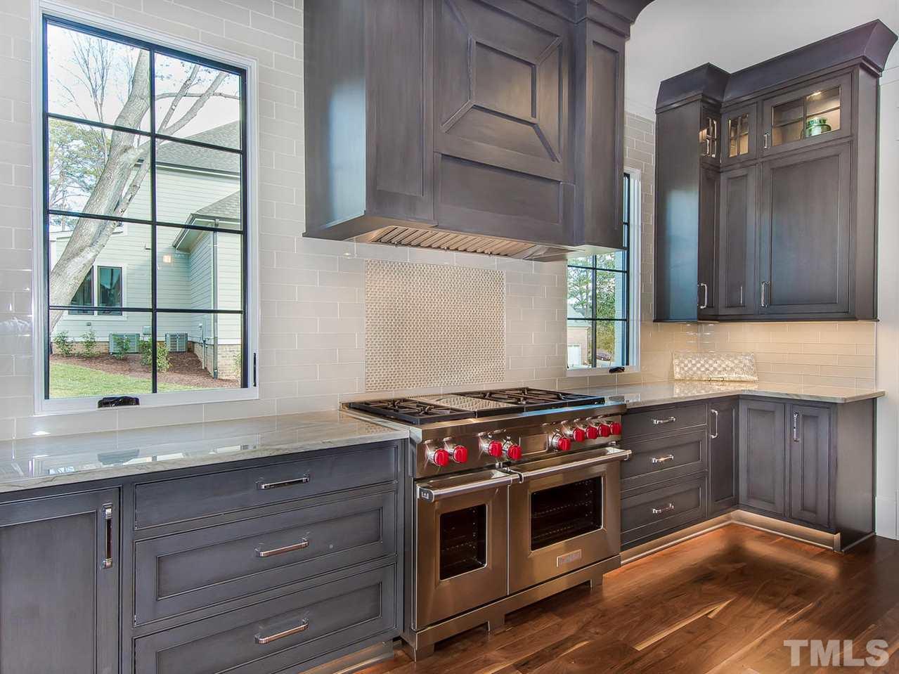 3210 Cobblestone Court Raleigh, NC 27607 - Photo 10 of 23 Plenty of Space and all the Details with Soft Close Drawers, Display Cabinets for your treasures, Amazing Hood and Back splash.