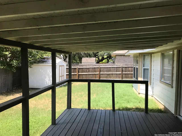 a view of room with window and wooden floor