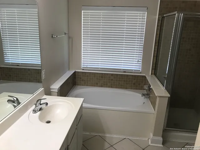 a bathroom with a bathtub and a sink
