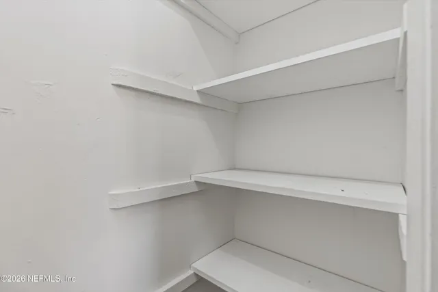 a view of an empty walk in closet