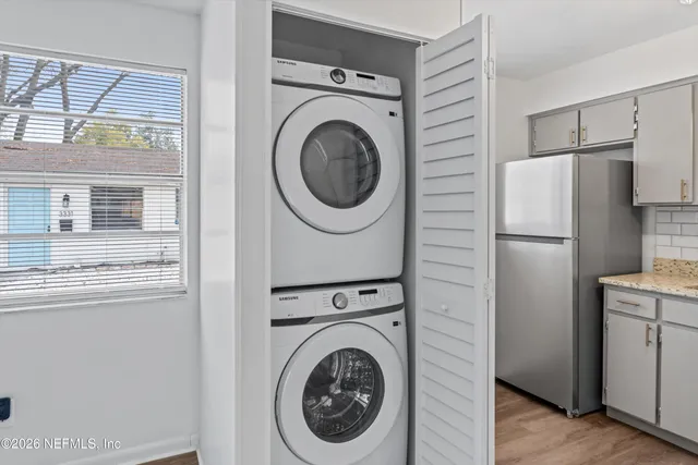 a view of a kitchen with washer and dryer