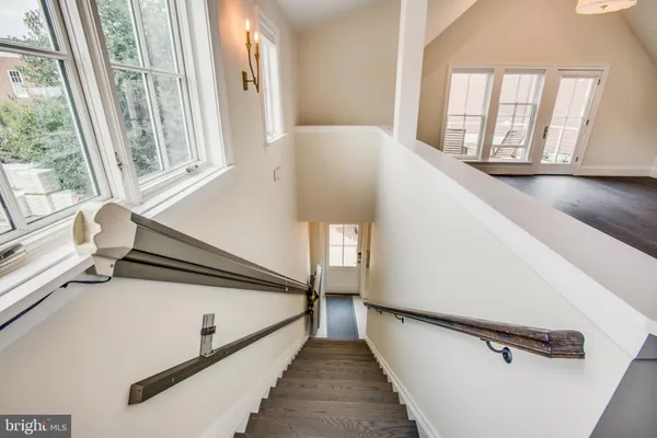 a view of a hallway with windows