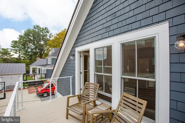 an outdoor sitting area with furniture